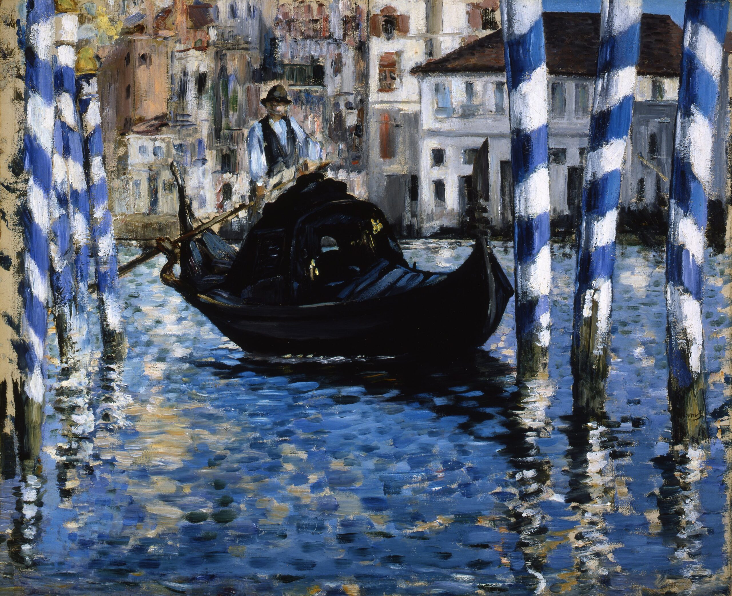 Both surrounding by blue and white striped poles in the water canals of Venice