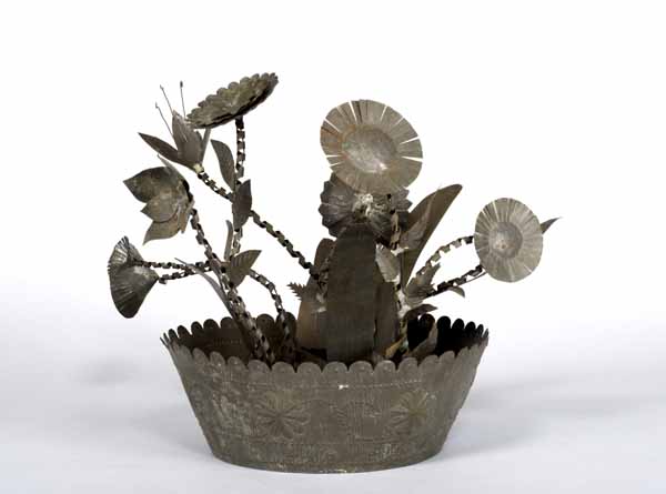 bowl of flowers made of tin
